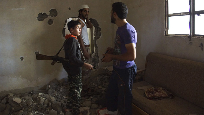 Dany, a 14-year-old fighter, whom activists say is the youngest fighter in the Khadraa brigade operating under the Free Syrian Army. Picture by Khalil Ashawi | Reuters